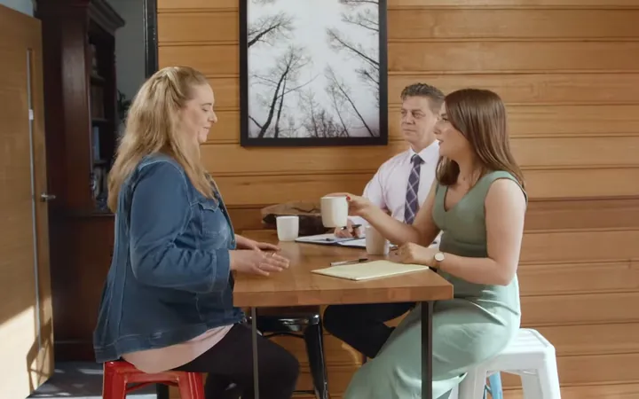 United Legal lawyer answering clients' questions at a table, injury law guides