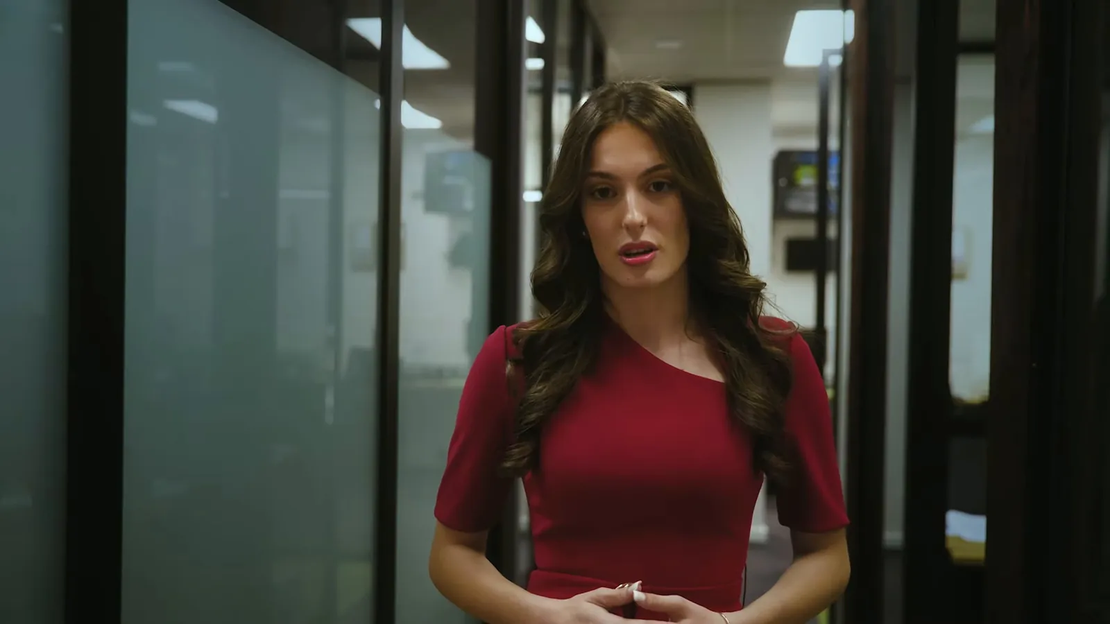 Woman in an office talking about birth injuries to mothers