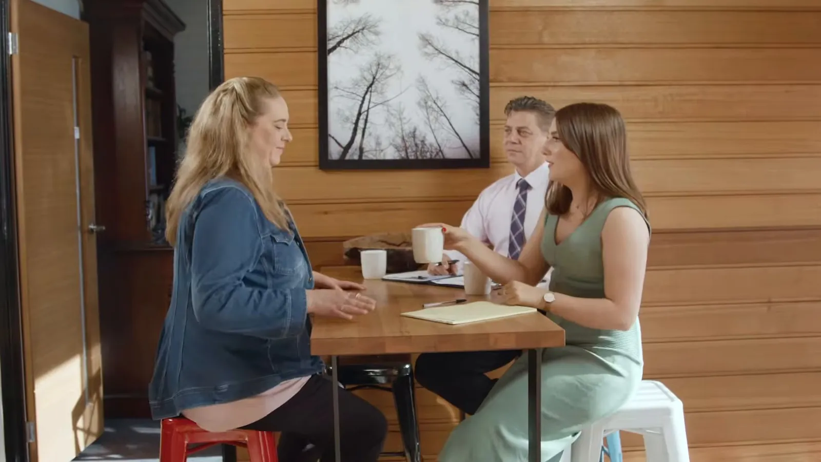 United Legal lawyer answering clients' questions at a table, injury law guides