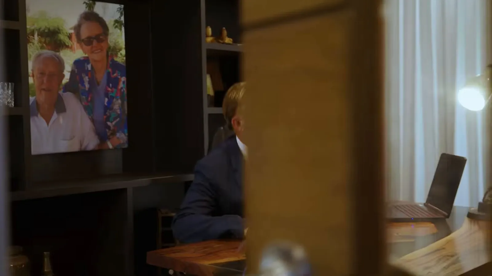 Lawyer working at his desk, seen through a doorway, landlord negligence claims
