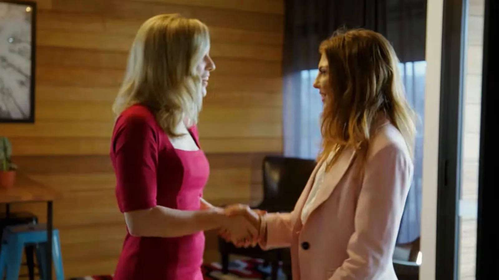 Lawyer greeting a client with a handshake, Kingston
