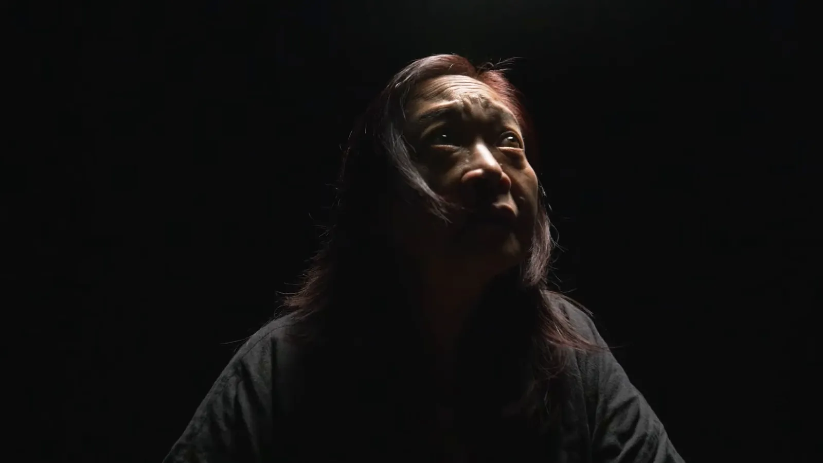 Woman in shadow, confidential compensation claims for sexual assault survivors